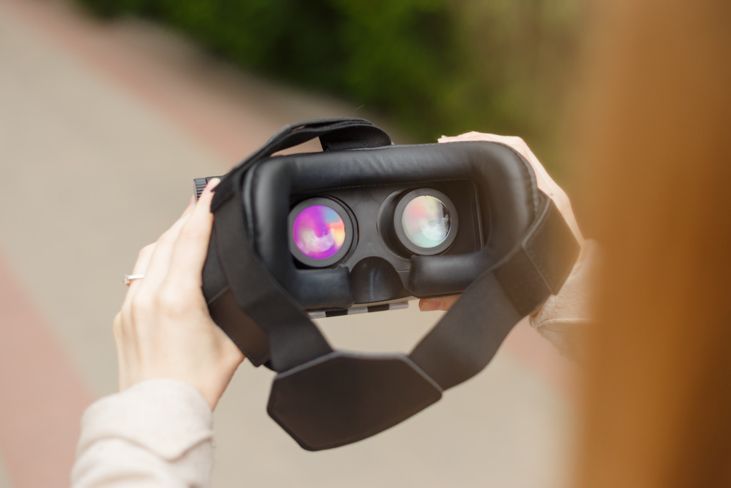 vr-headset-in-woman-hands