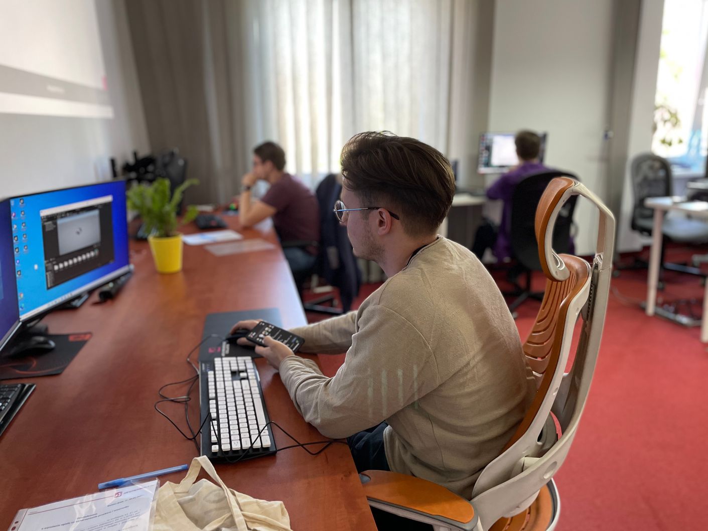 Two students practicing their Unity skills during the first edition of 4Experience College