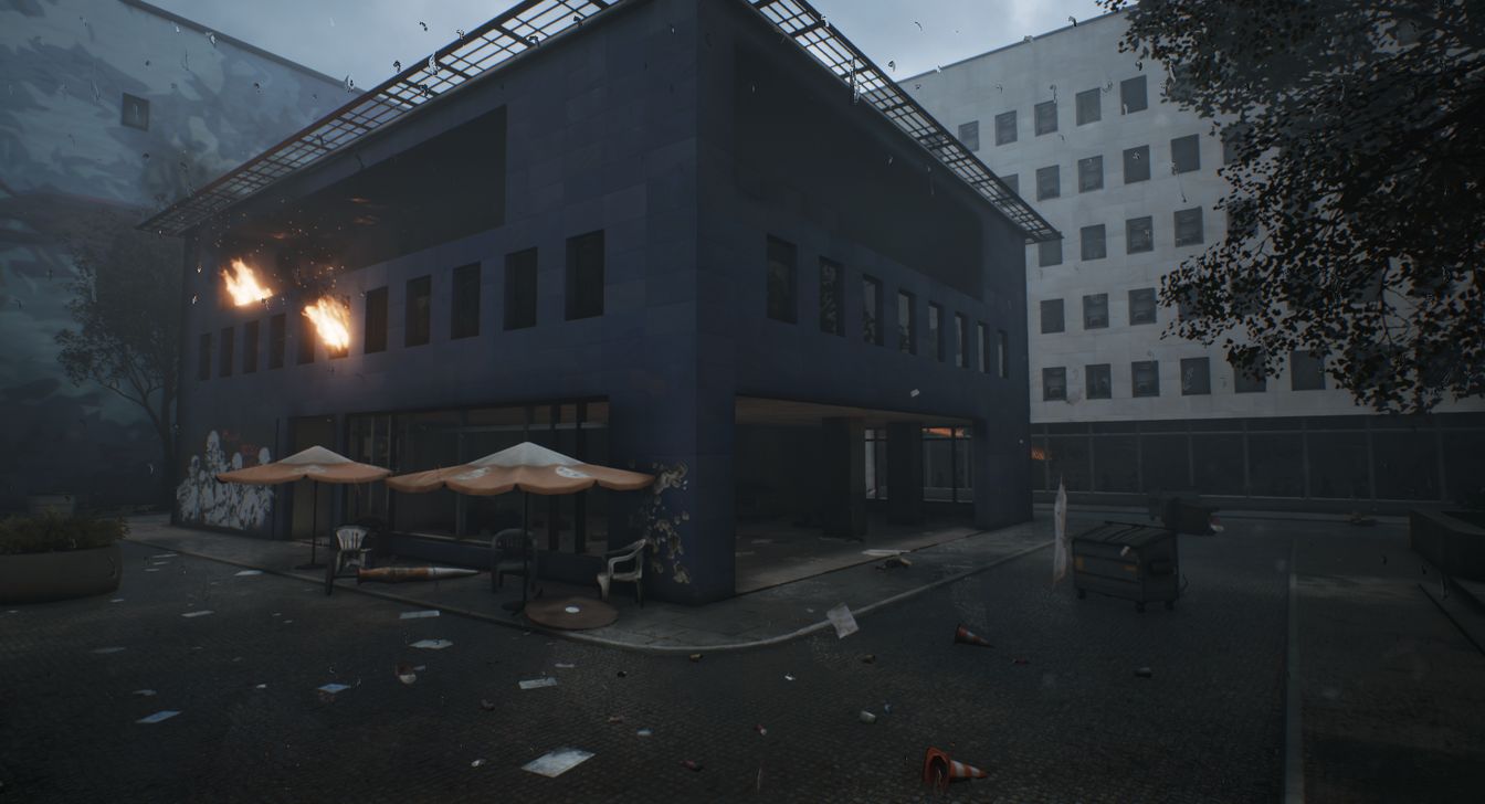 Burning building in city centre - screenshot from a video game called World War 3
